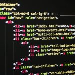 Close-up of vibrant HTML code displayed on a computer screen, showcasing web development and programming.