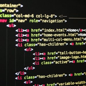 Close-up of vibrant HTML code displayed on a computer screen, showcasing web development and programming.