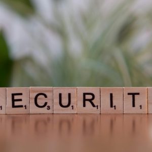 Close-up of wooden Scrabble tiles spelling SECURITY, symbolizing cybersecurity and protection.